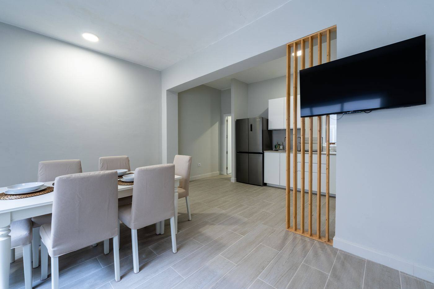 Dining table with the kitchen behind