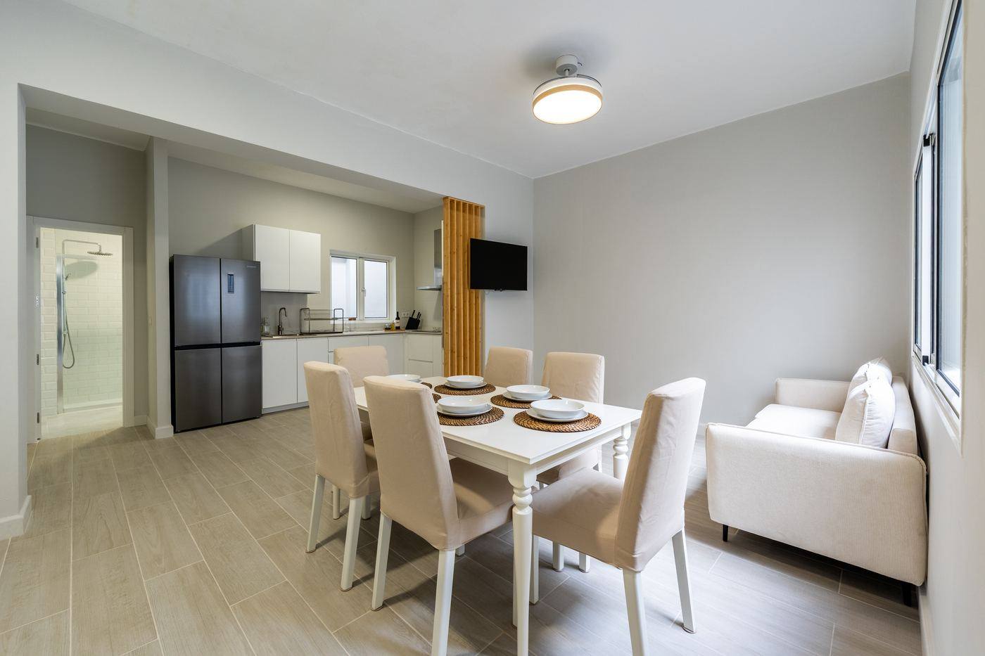Living-dining room with kitchen behind
